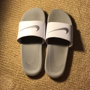 white Nike slides